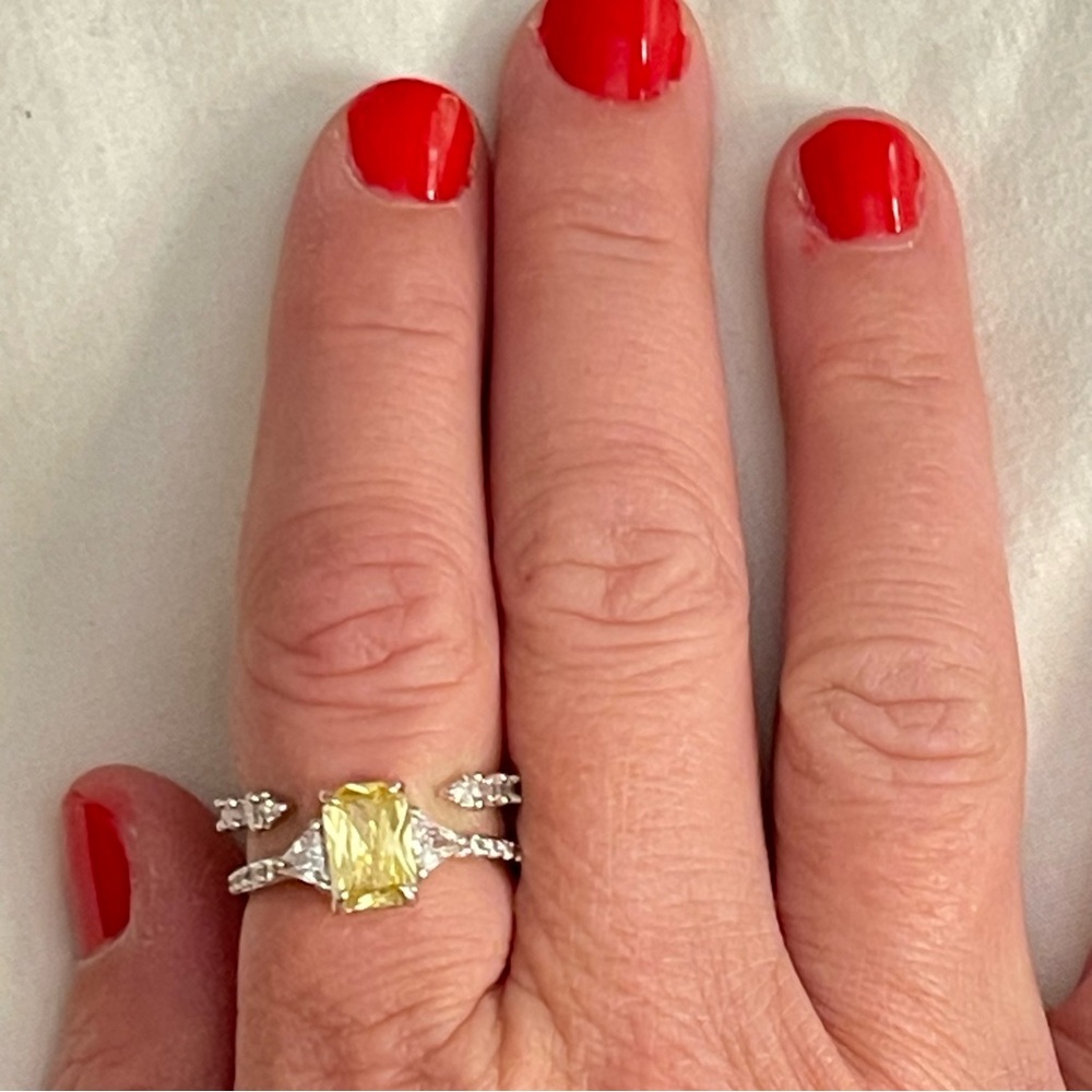 Lemon yellow quartz with cubic zirconia set in rhodium. Size 9 ring.